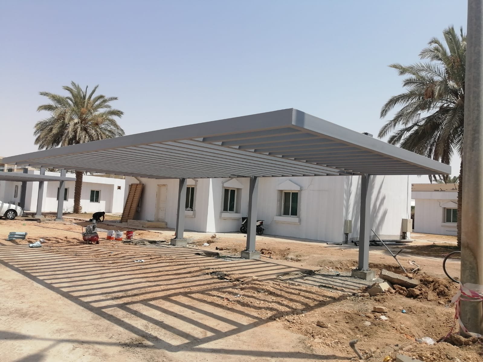 شركة النخبة  لتركيب المظلات والسواتر بالرياض تركيب وحدادة جميع انواع المظلات مظلات سيارات مظلات جلسات خارجية مظلات حدائق مظلات شينكو تركيب ساندوتش بانل مظلات متحركة مظلات خارجية بجودة عالية 